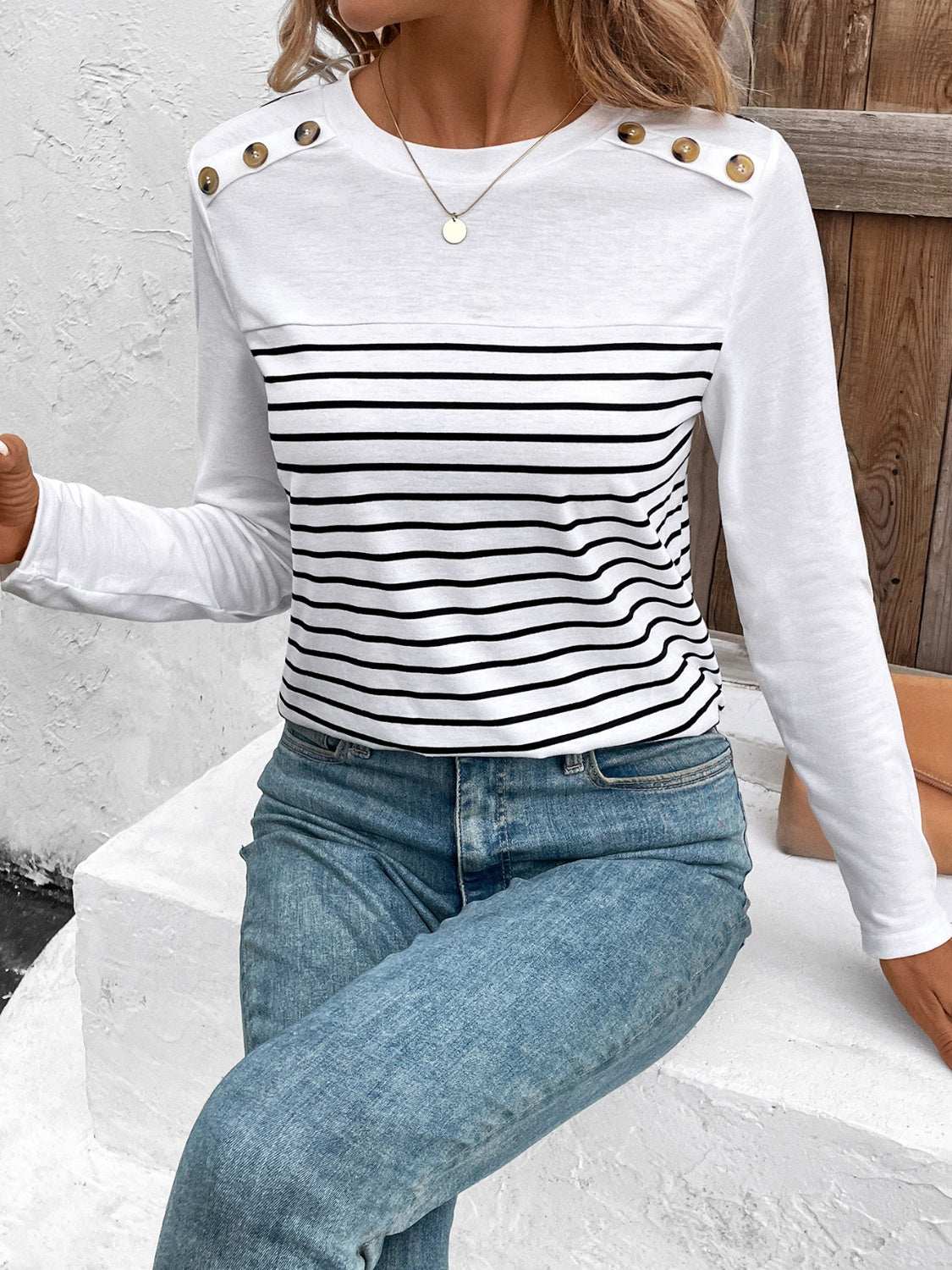 Decorative button striped round neck long sleeve T-shirt with jeans.