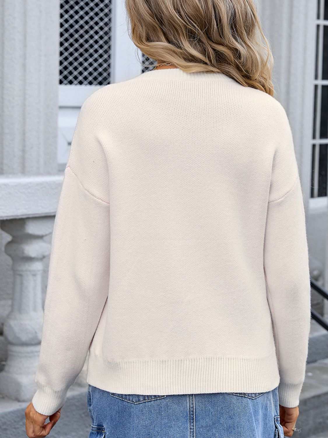 Back view of Angel Wings Bow Graphic Round Neck Long Sleeve Sweater in ivory.