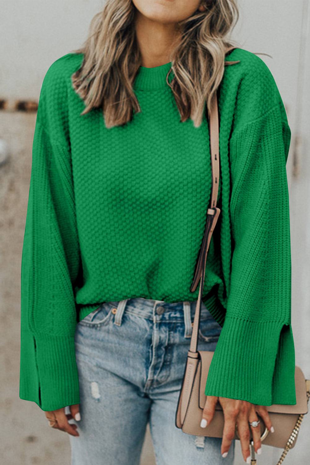 Textured round neck long sleeve sweater in green with a slit design.