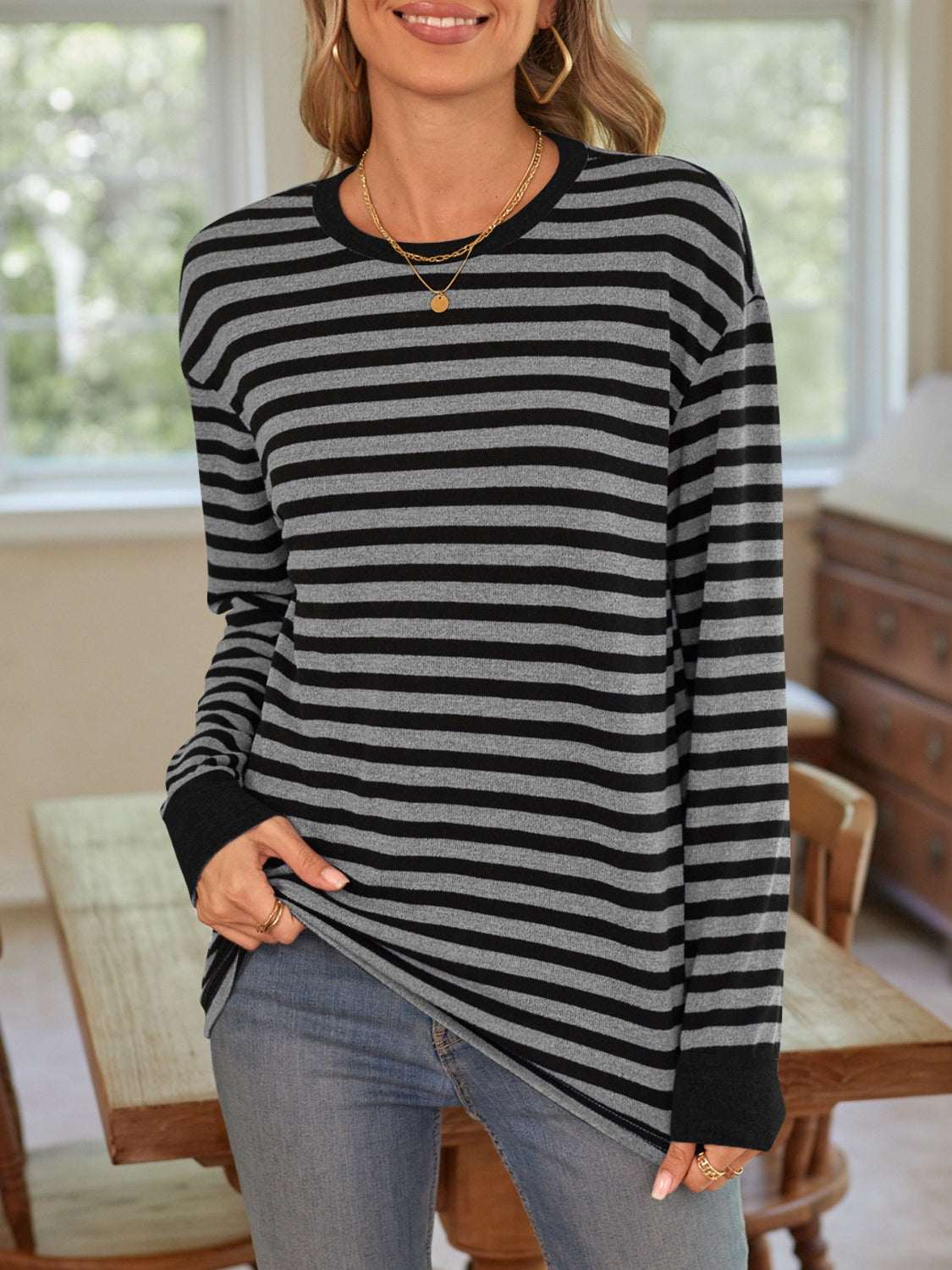 Lovelet striped round neck long sleeve t-shirt with black and gray stripes.