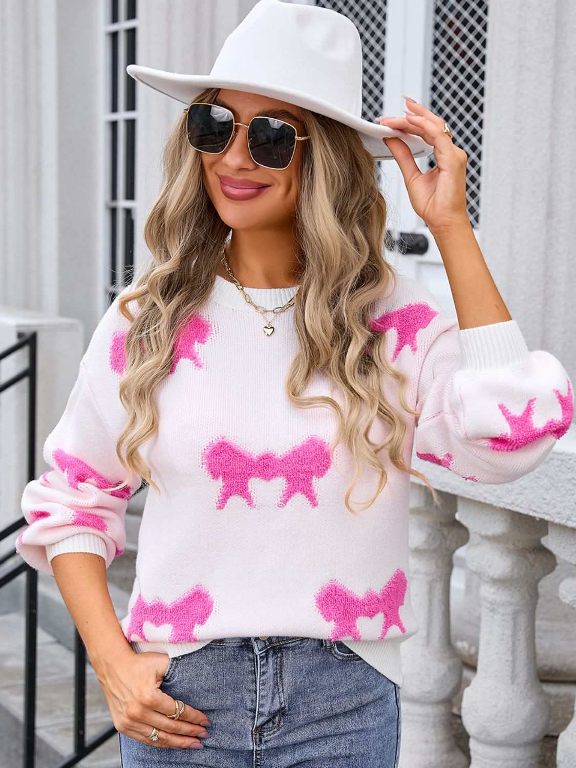 Angel Wings Bow Round Neck Dropped Shoulder Sweater in pink and white with moderate stretch.
