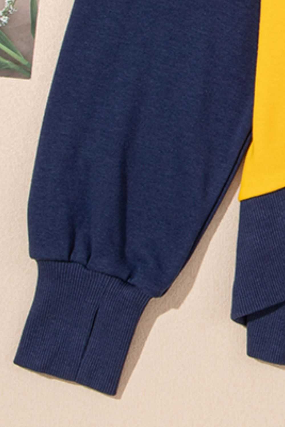 Contrast round neck long sleeve sweatshirt, polyester-cotton blend, navy and yellow design.