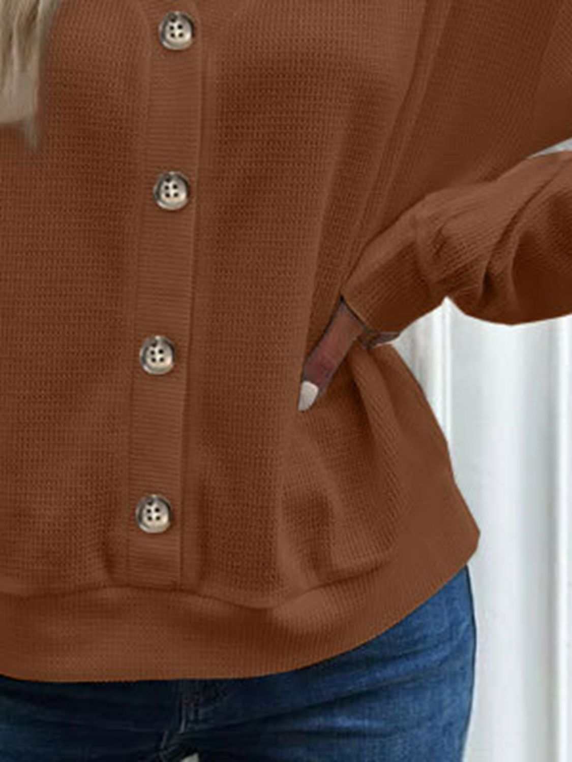 Casual waffle-knit V-neck blouse with long sleeves in solid color.