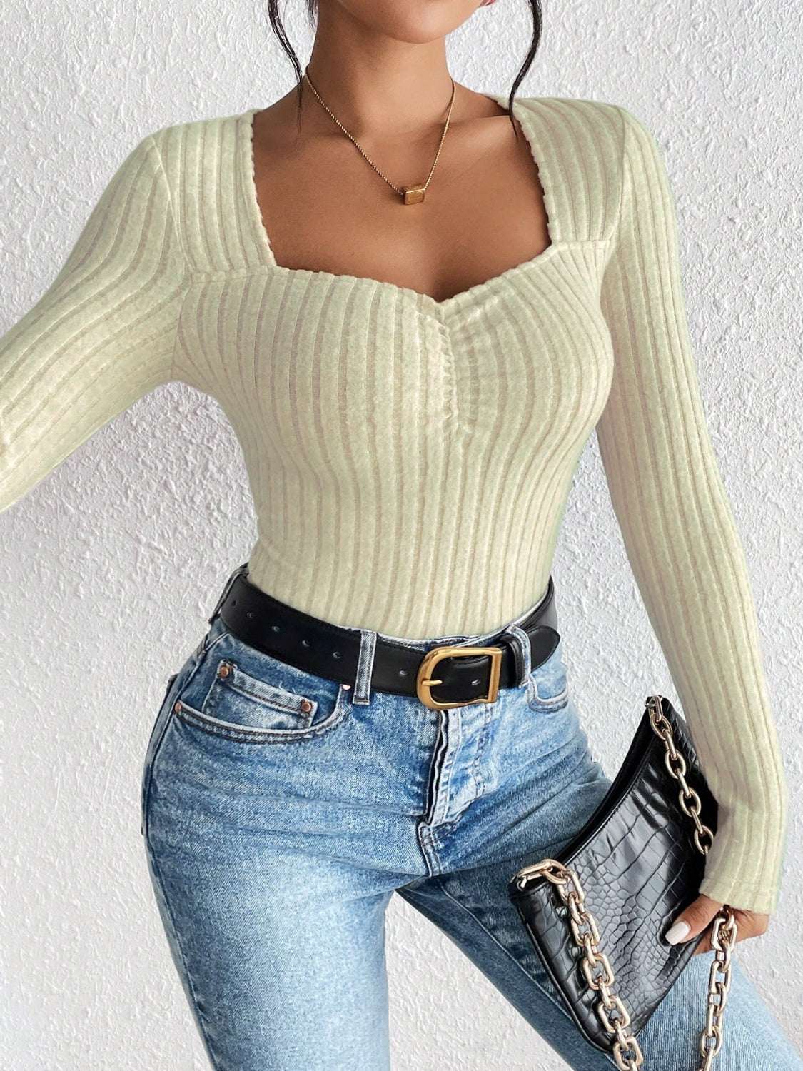 Honey ribbed long sleeve t-shirt, slightly stretchy, 95% polyester, styled with jeans.
