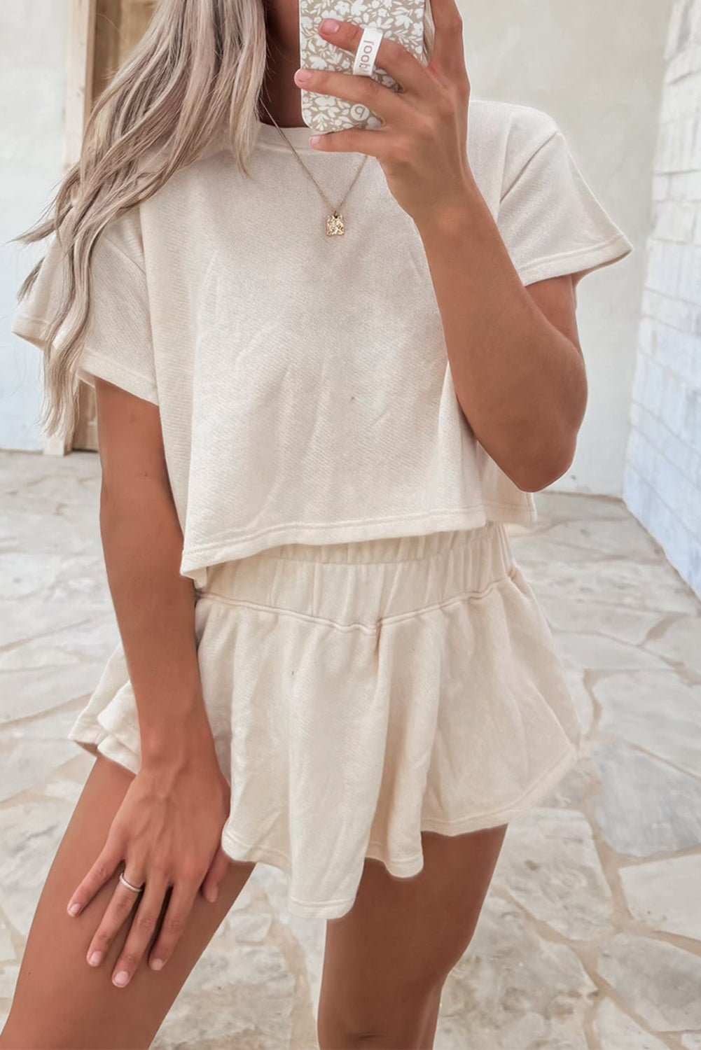 Beige 2pcs cropped tee and ruffle high waist skort set, casual chic outfit.