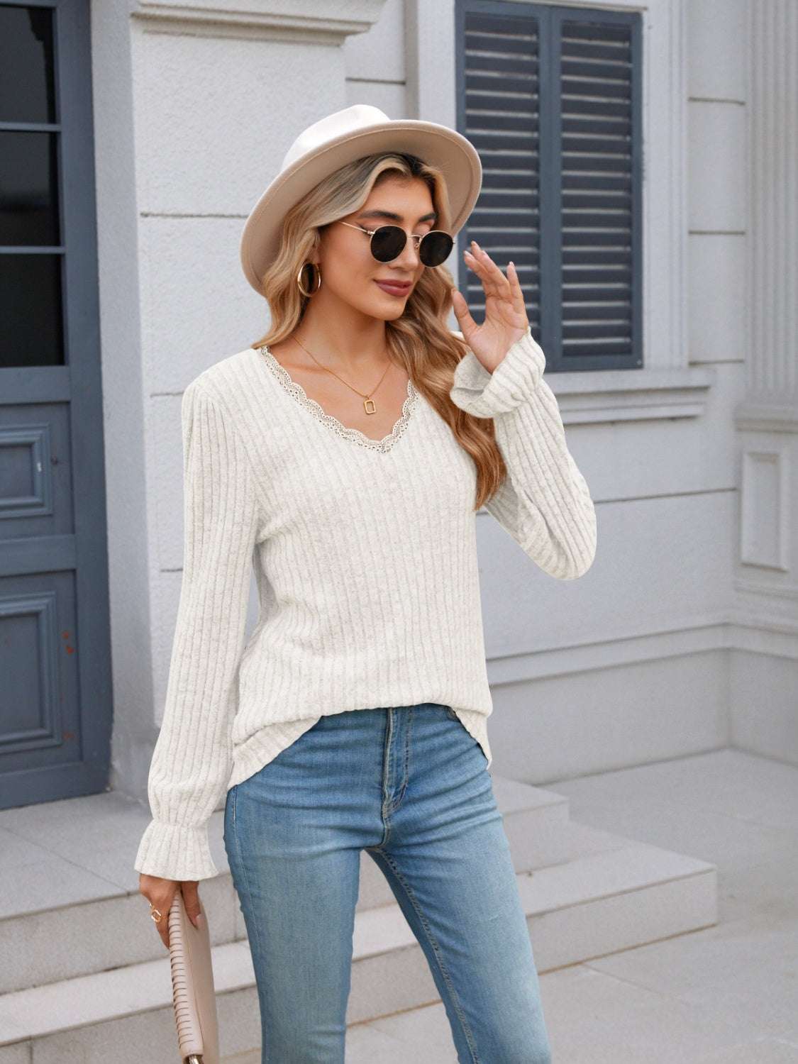 Lace detail V-neck long sleeve T-shirt in white, paired with jeans and accessories.