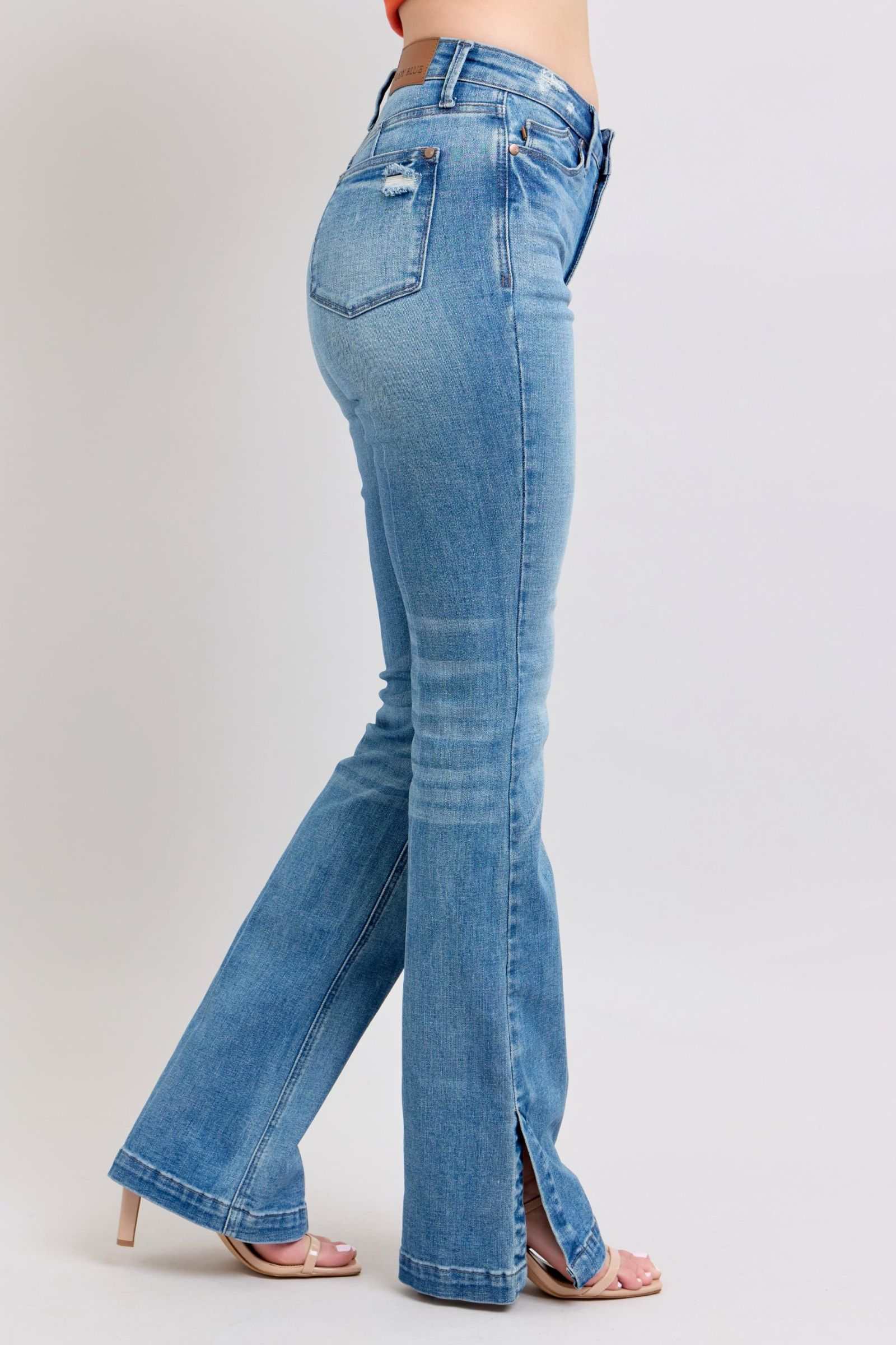 Judy Blue HW high-waisted vintage wash slim bootcut jeans with side slit.