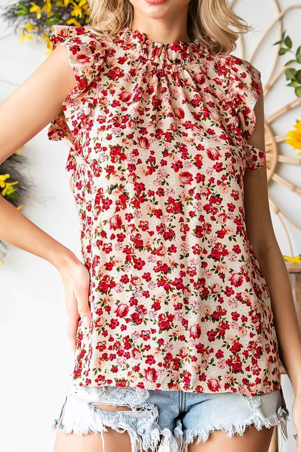 Ruffled floral round neck cap sleeve blouse in red and beige.