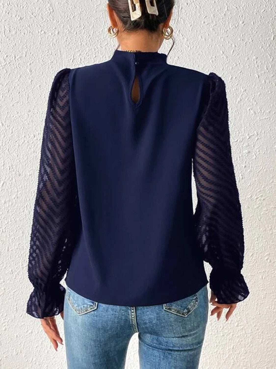 Mock Neck Flounce Sleeve Blouse in navy with semi-sheer ruffled sleeves.
