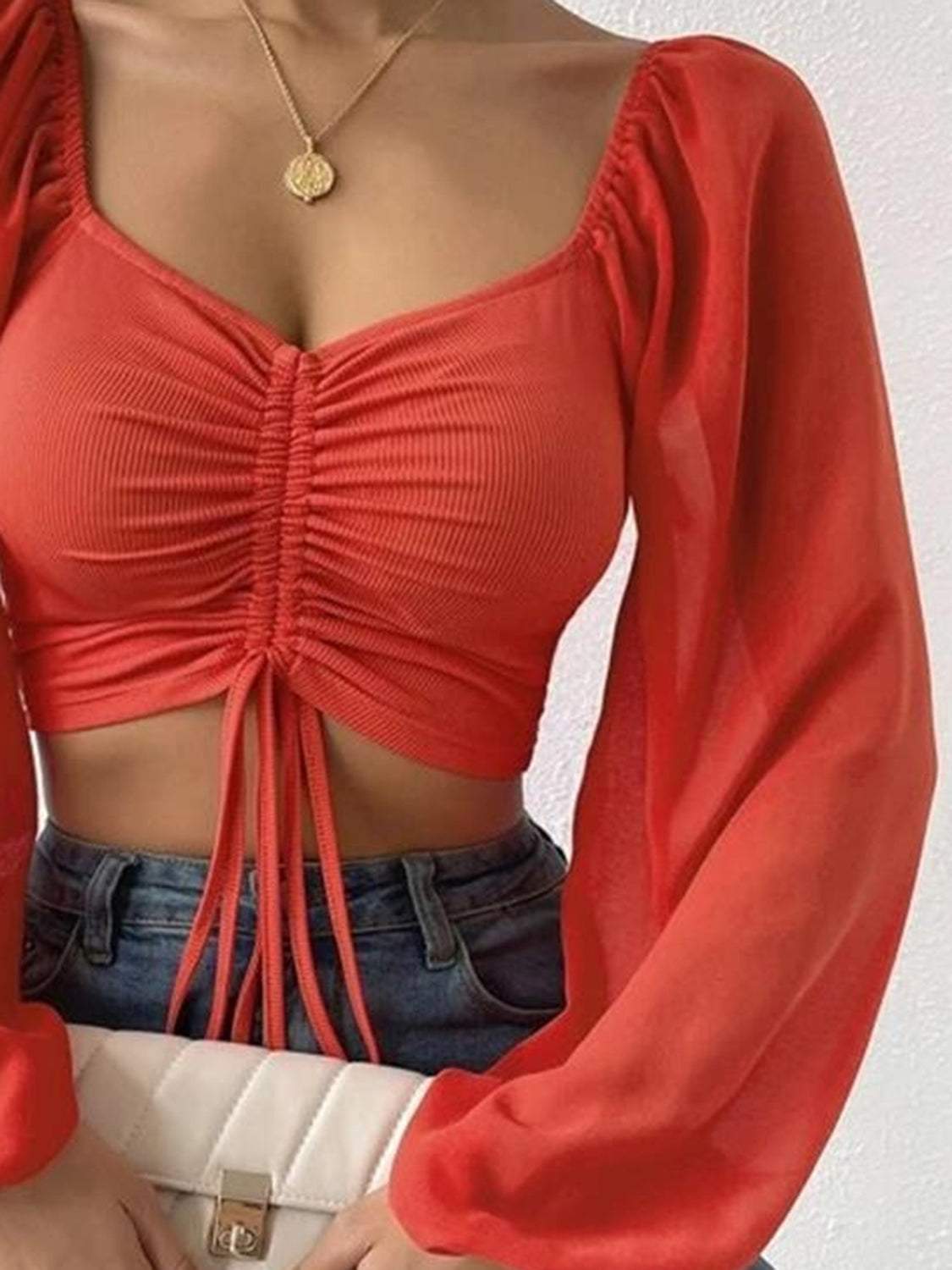 Drawstring Sweetheart Neck Cropped Top in red, semi-sheer with long sleeves, styled with a pullover closure.