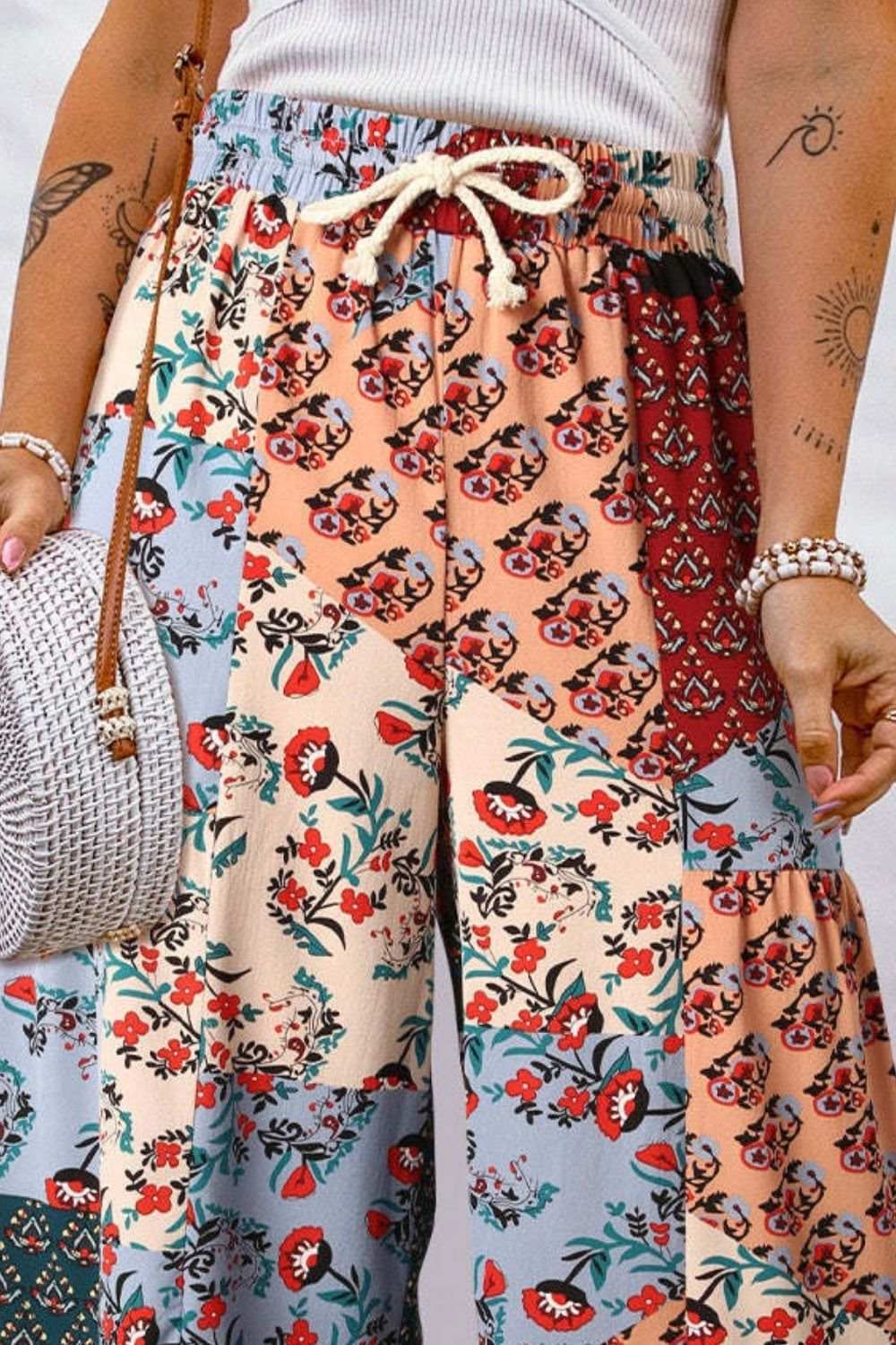 Full size drawstring printed wide leg pants with colorful floral pattern.