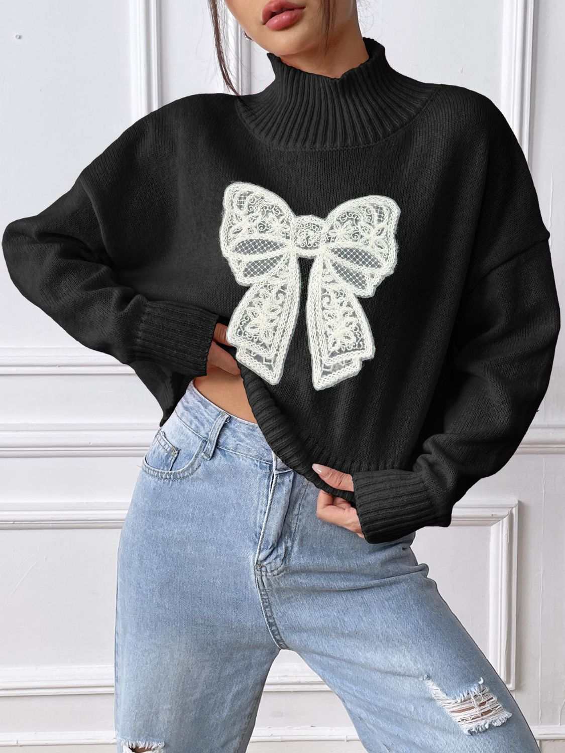 Bow Turtleneck Long Sleeve Sweater in black, featuring a basic style with a slightly stretchy fit, crafted from 100% polyester.