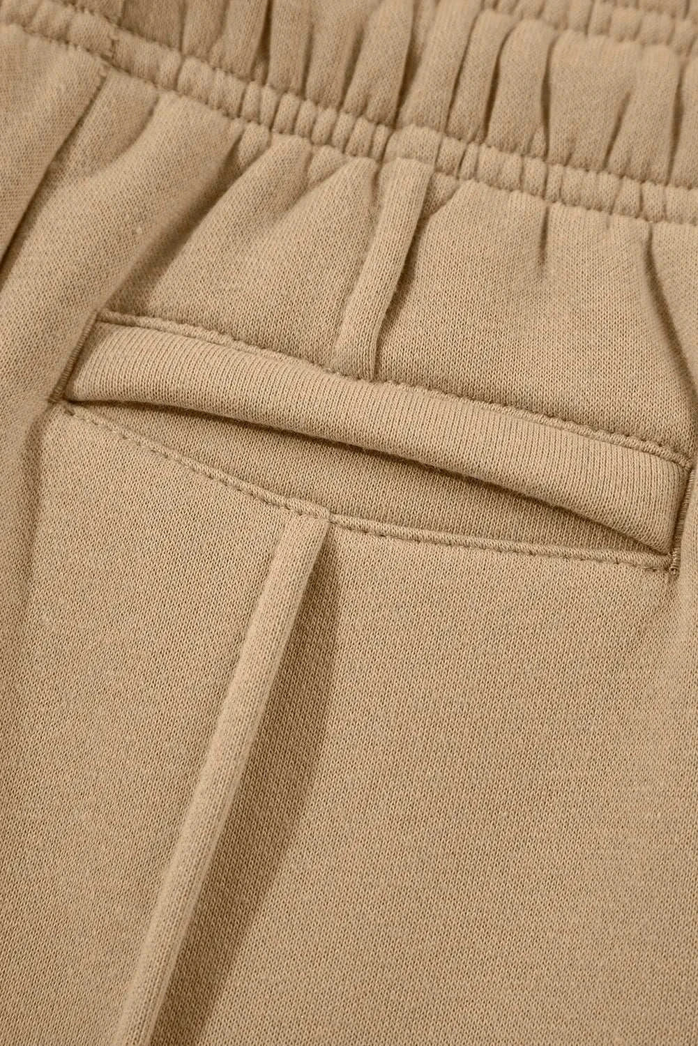 Drawstring wide leg pants with pockets, close-up of pocket detail.