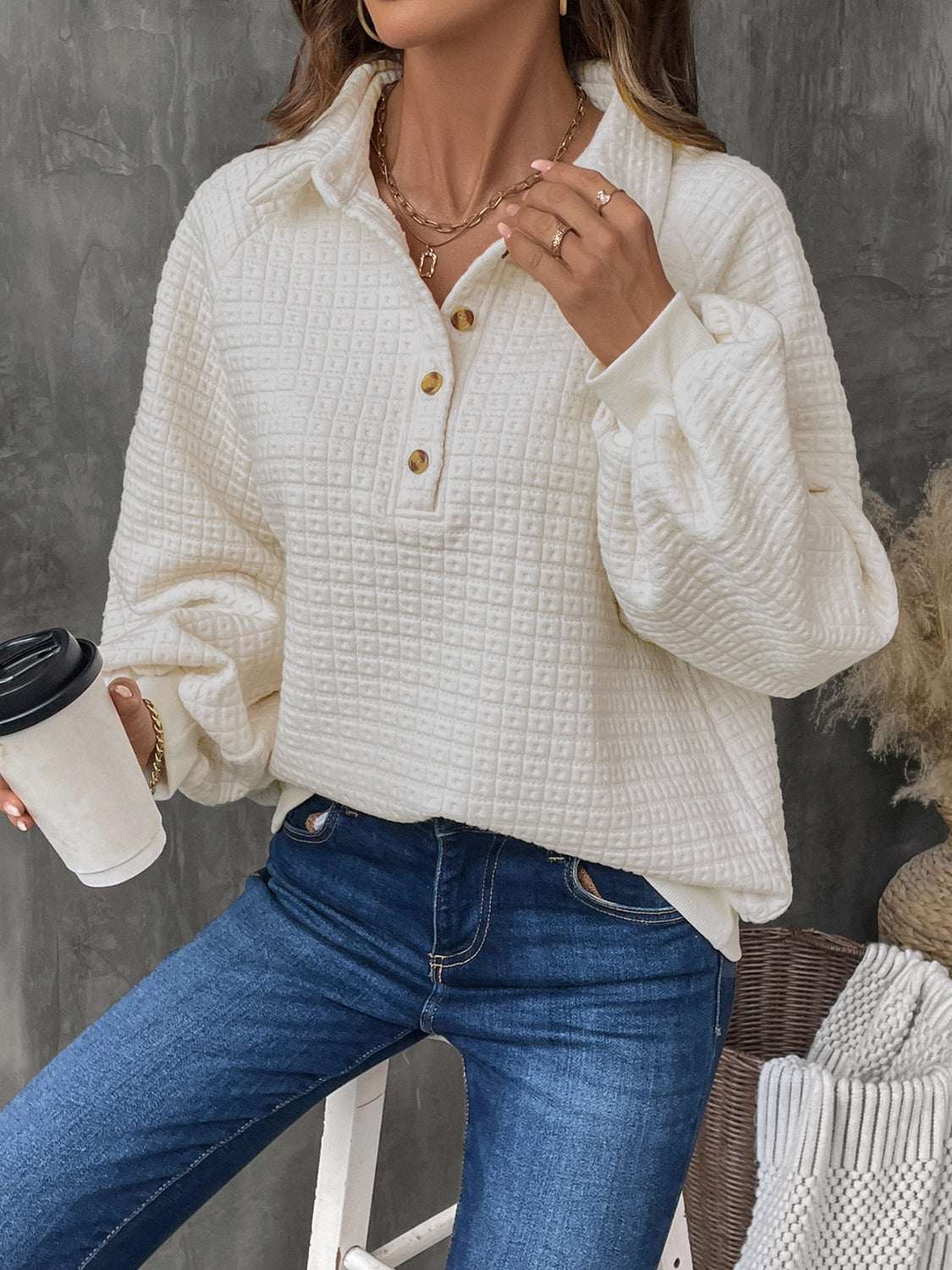 Perfee Half Button Long Sleeve Sweatshirt in white with buttoned details and textured fabric.