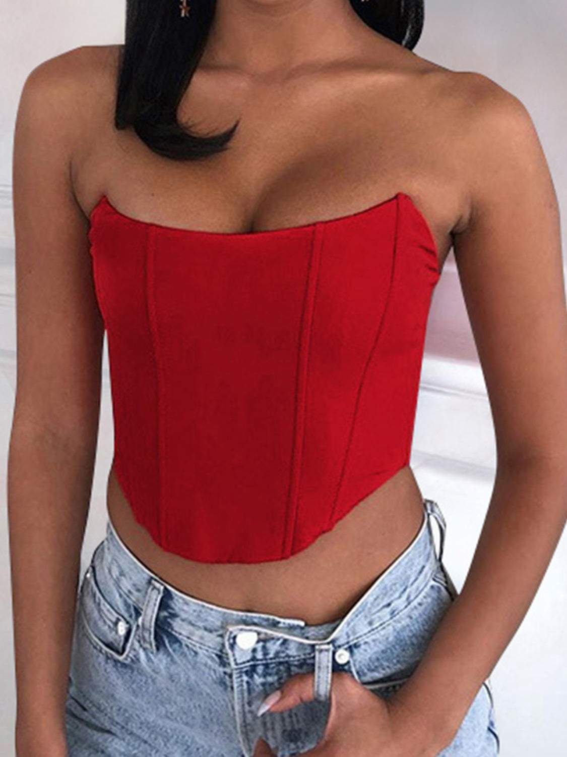 Red tube cropped top made of 95% polyester and 5% spandex, slightly stretchy, worn with denim jeans.