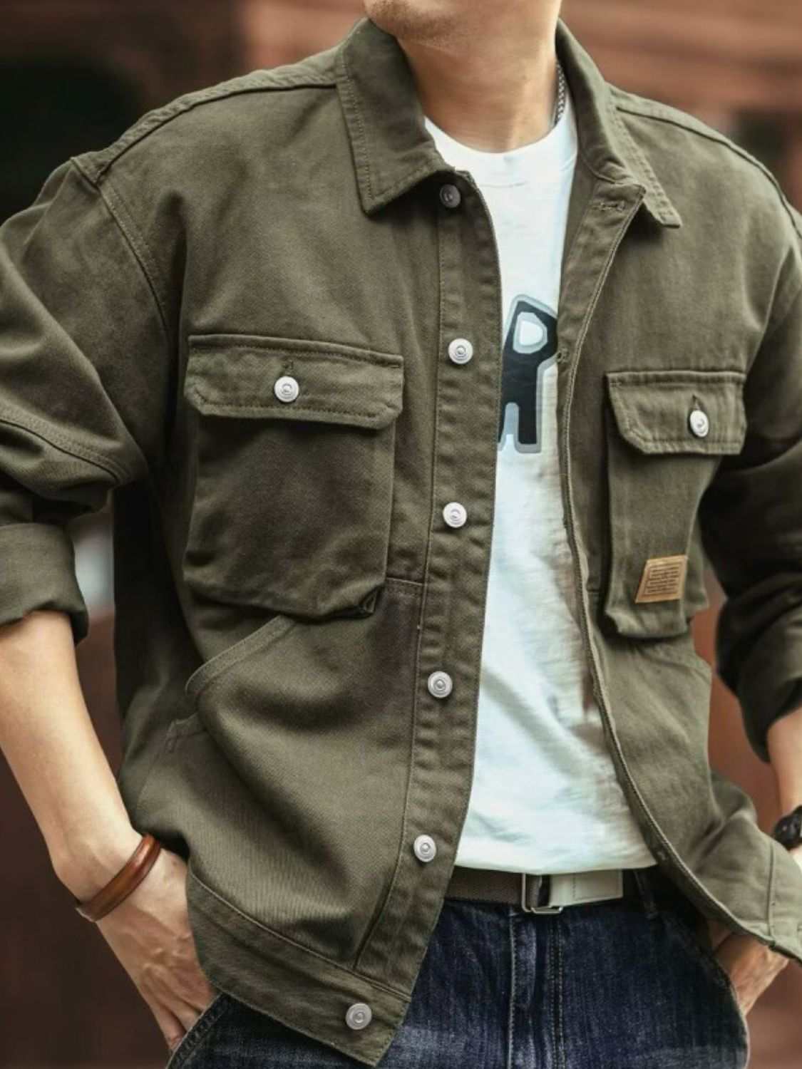 Men's Washed Collared Neck Cargo Jacket in green with front pockets and button closure.