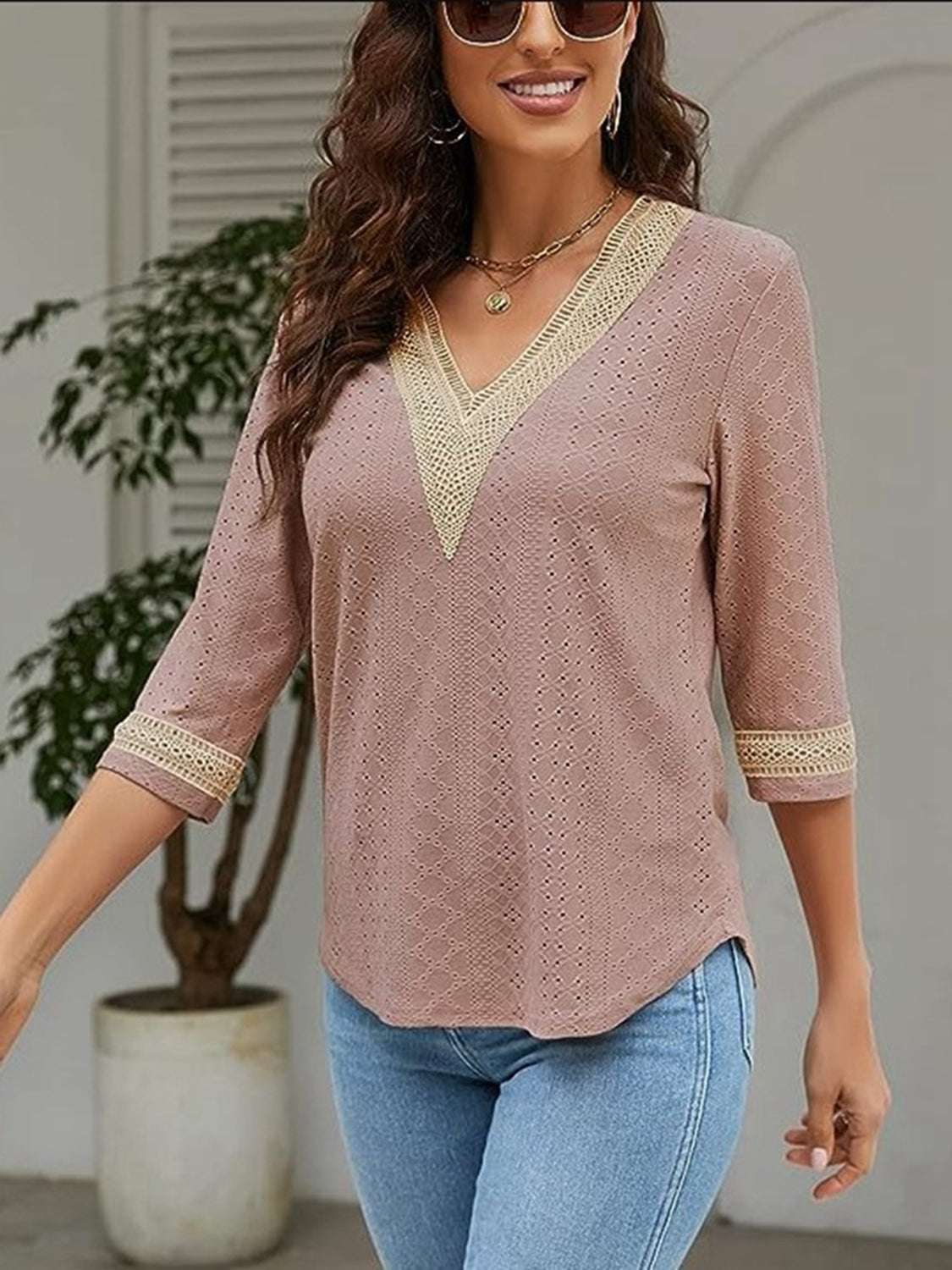 V-Neck Eyelet Blouse in pink, featuring a basic style with opaque fabric and no stretch, made from 100% polyester.