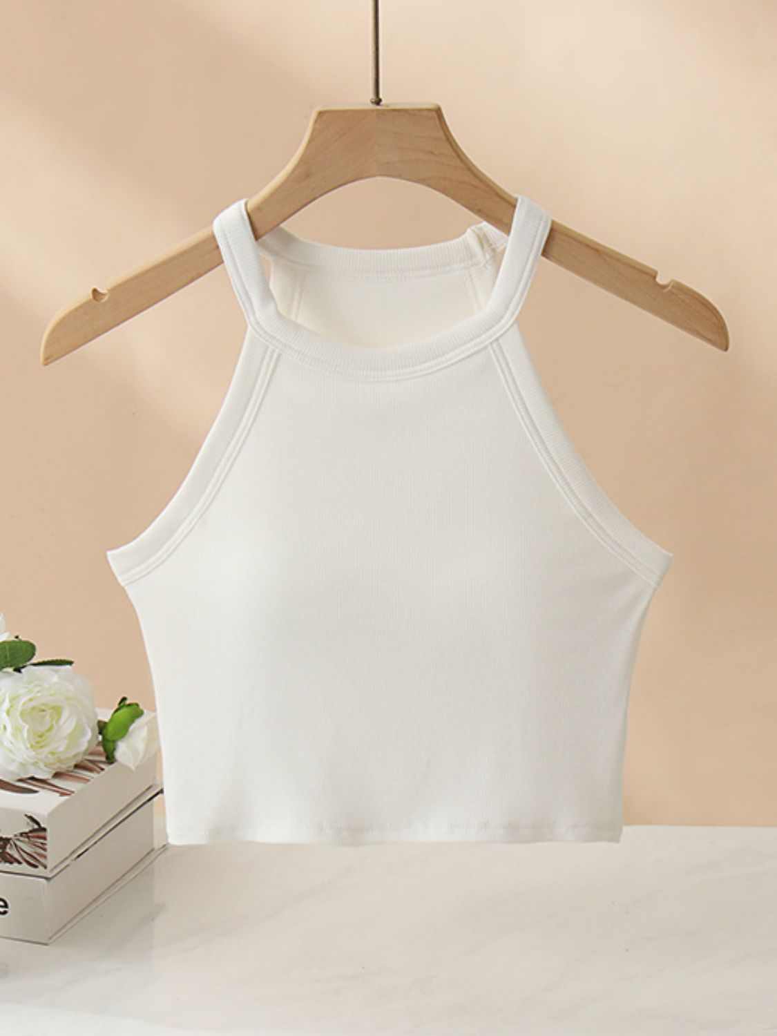Ribbed Grecian neck cropped tank top with chest pads, white, highly stretchy fabric.