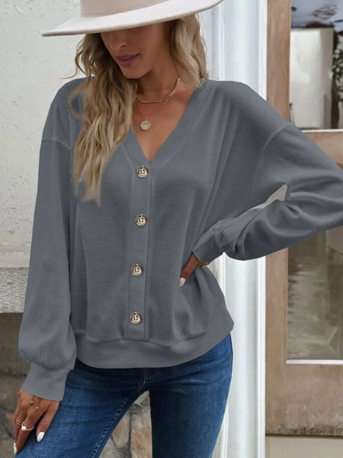 Casual solid waffle-knit V-neck dropped shoulder blouse with long sleeves in gray.