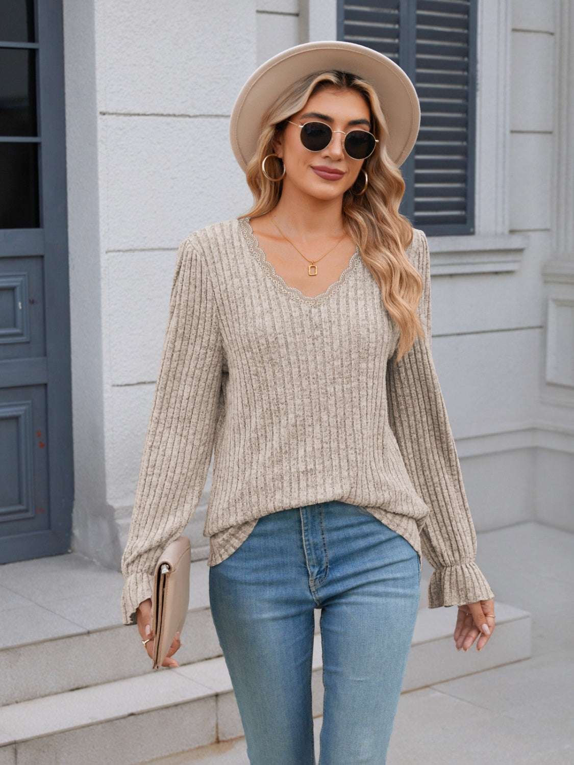 Lace detail V-neck long sleeve t-shirt with ruffled design and slightly stretchy material.