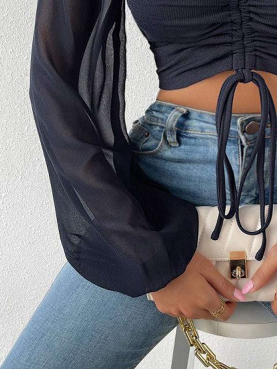 Drawstring sweetheart neck cropped top with semi-sheer sleeves.