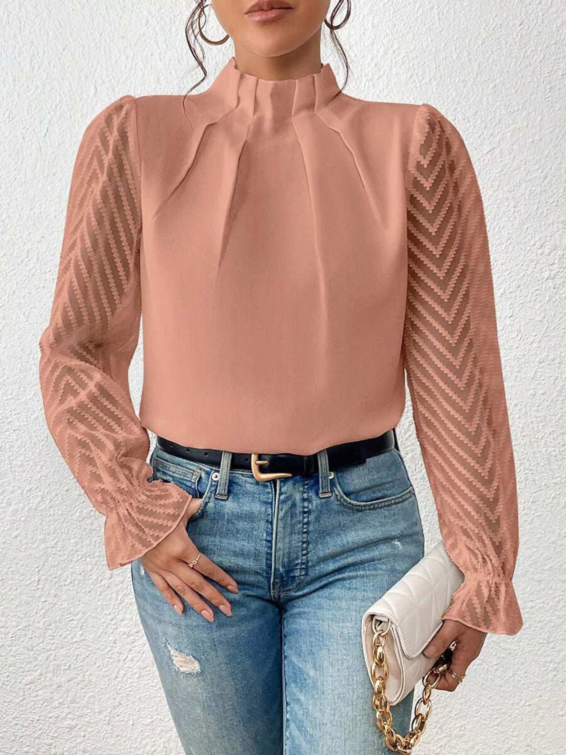 Mock neck flounce sleeve blouse in semi-sheer ruffled polyester fabric.