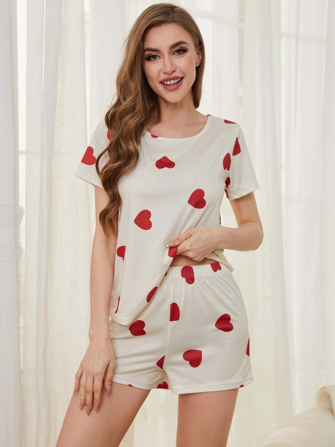 Heart round neck top and shorts lounge set with red heart prints, two-piece, polyester-spandex blend.