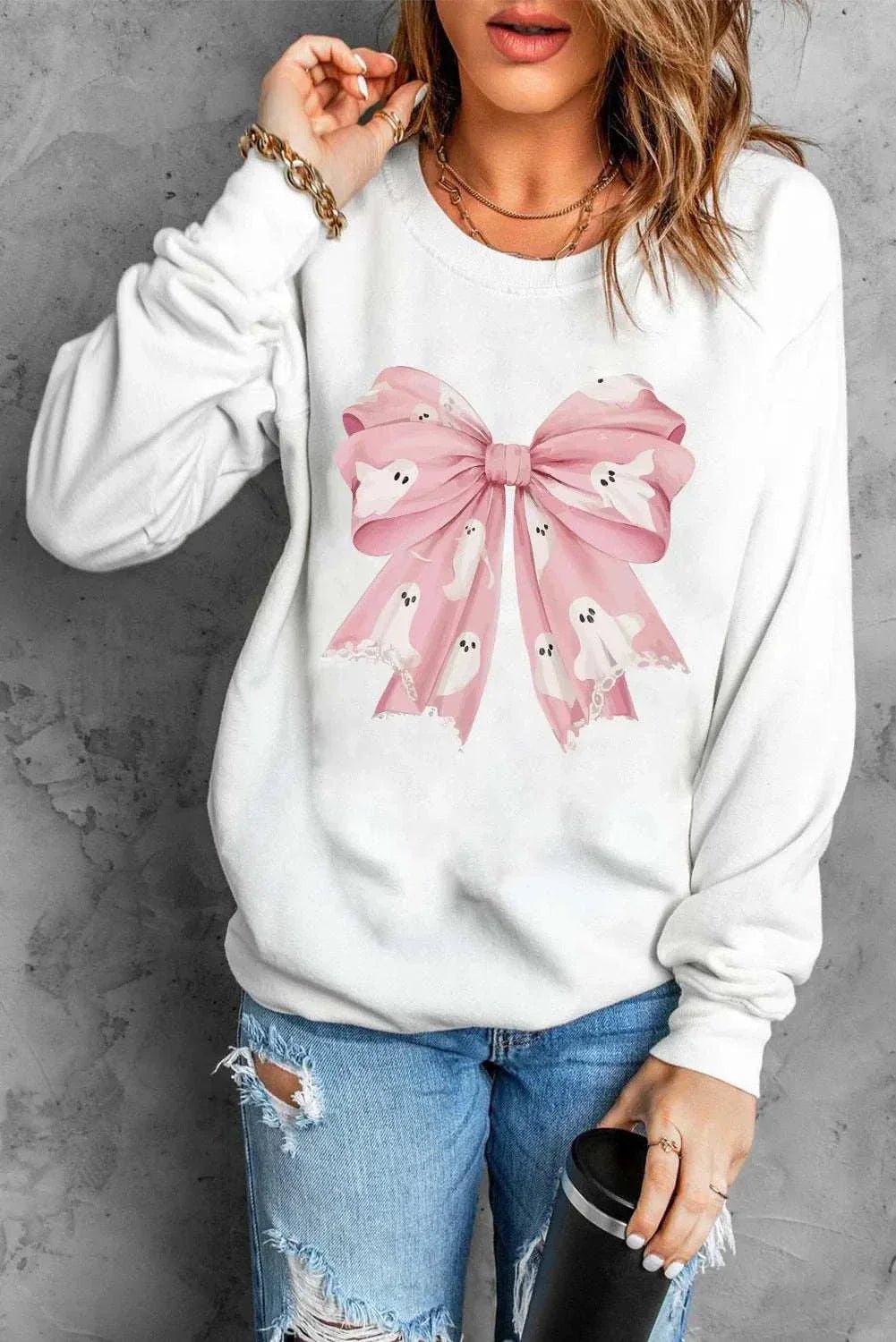Bow Round Neck Long Sleeve Sweatshirt with pink bow design.