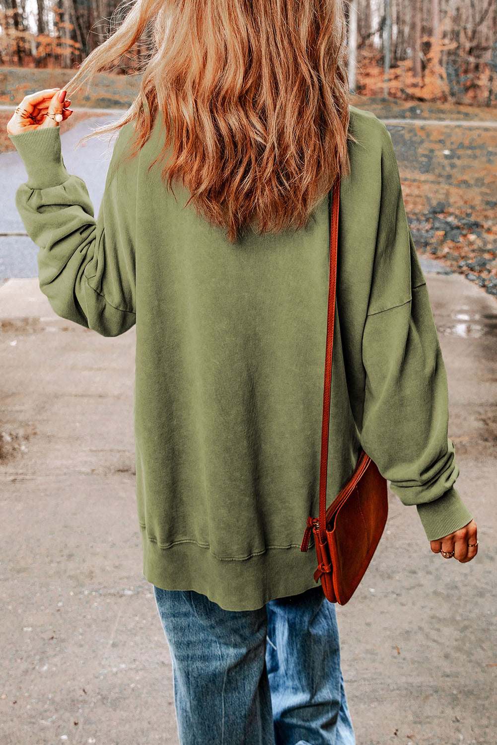 Casual dropped shoulder round neck long sleeve blouse in solid color.