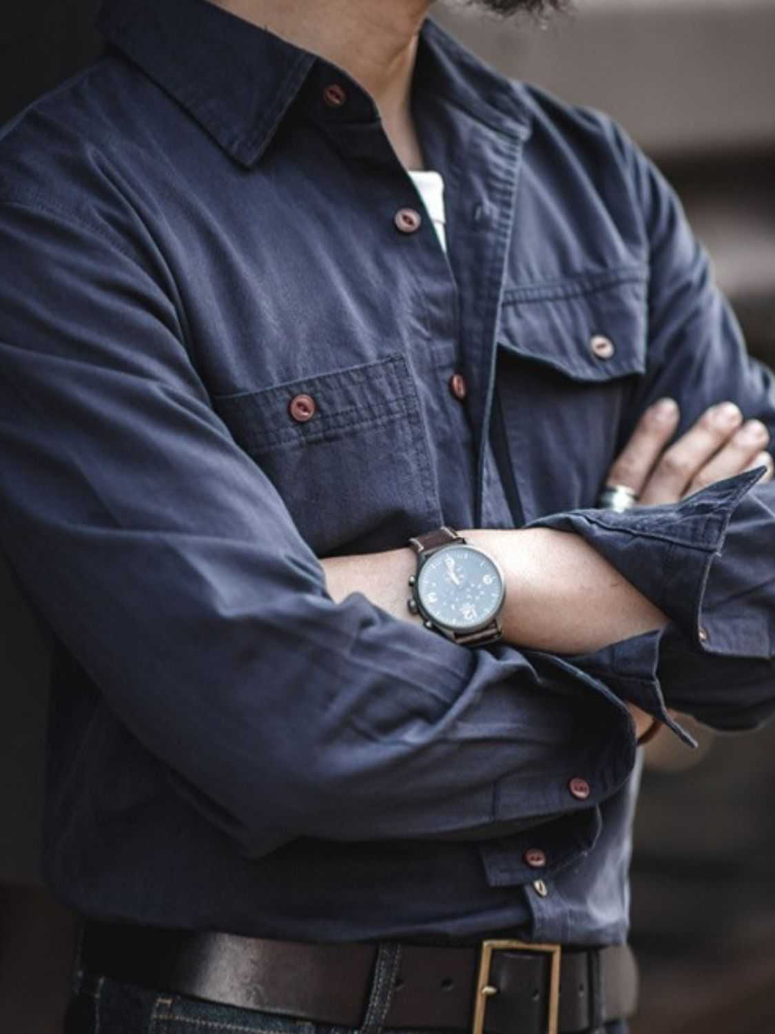 Men's button down long sleeve shirt with chest pockets in navy, slightly stretchy cotton-polyester blend.
