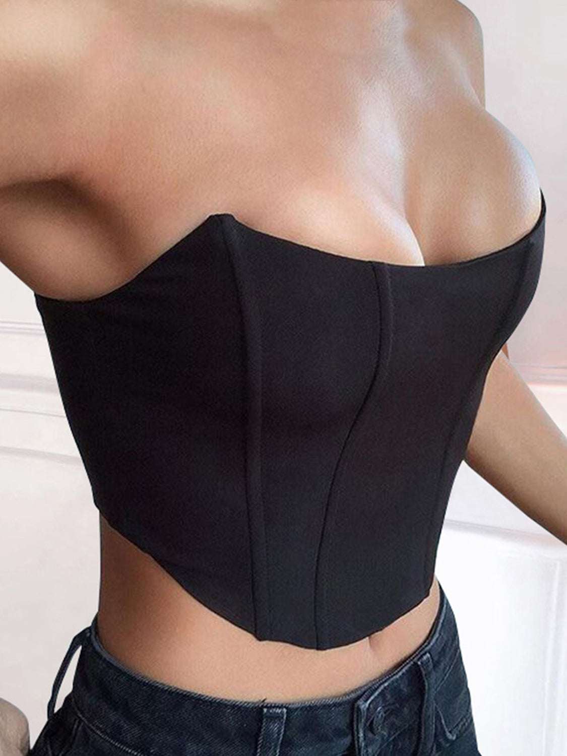 Black tube cropped top, slightly stretchy polyester-spandex blend, basic style.