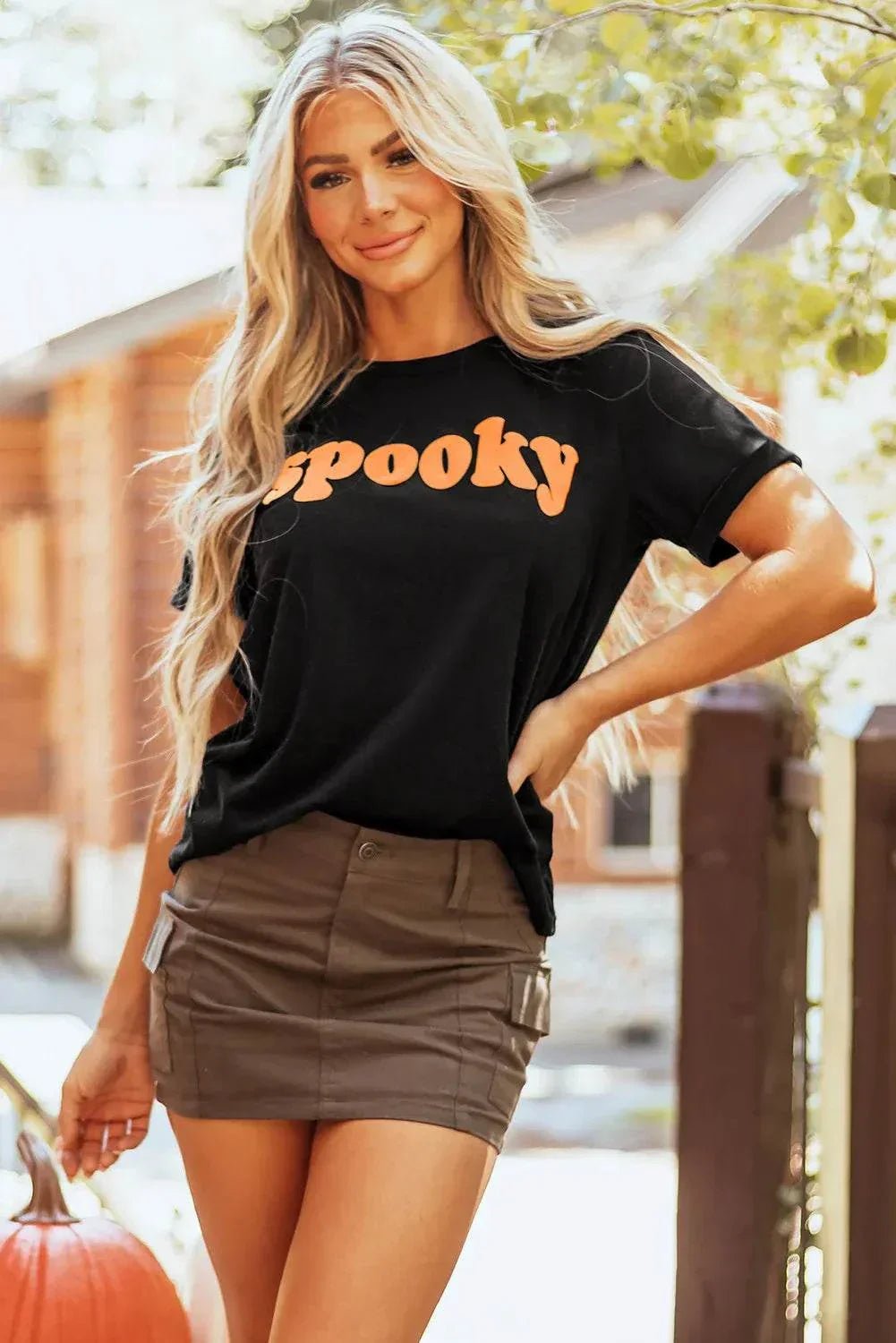 SPOOKY Round Neck Short Sleeve T-Shirt with Halloween-themed print worn by a woman.