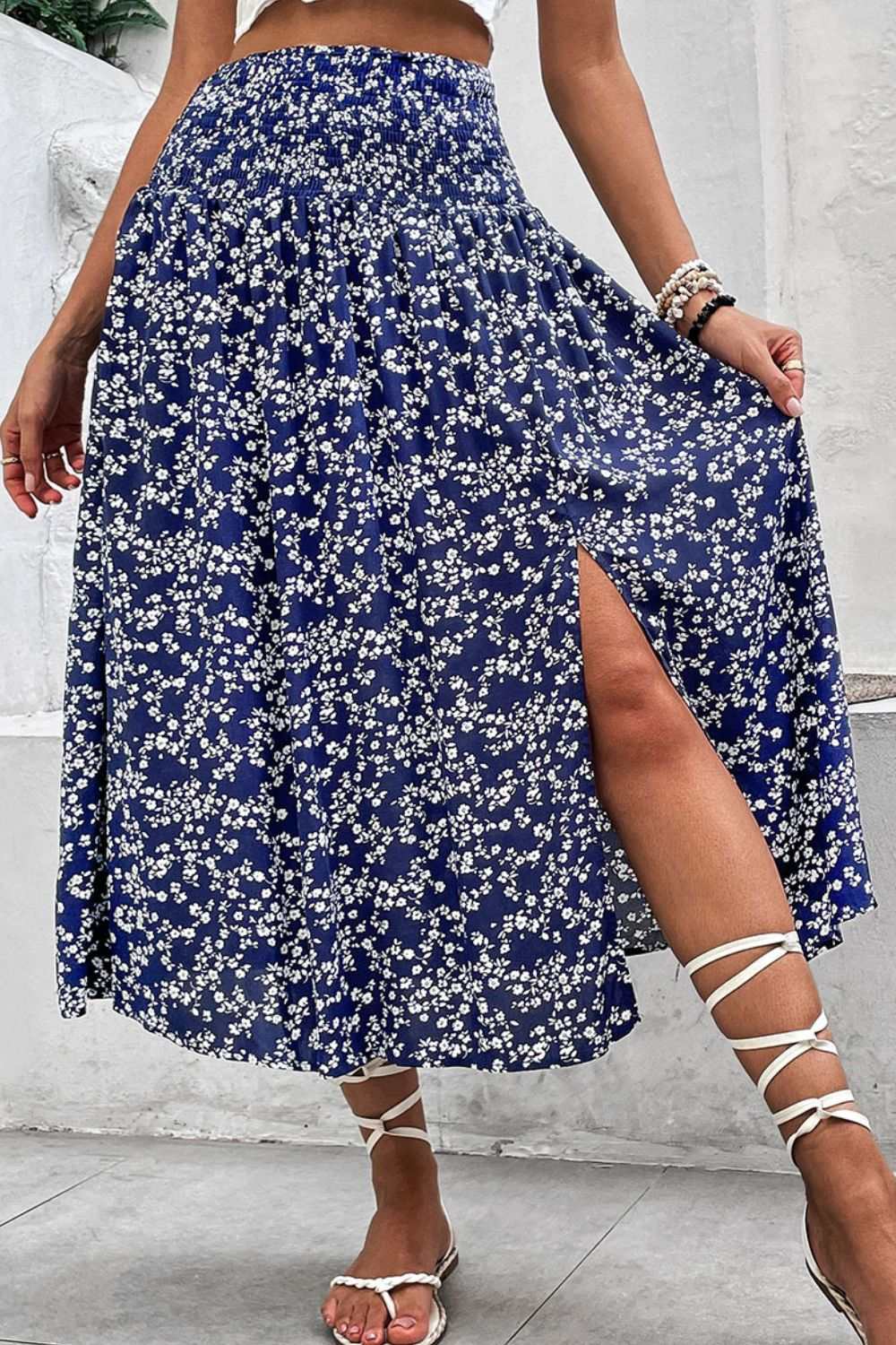 Ditsy floral high waist skirt with slit, blue midi length, vacation style.