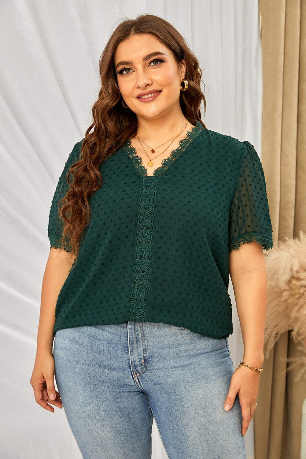 Plus size green Swiss dot lace V-neck blouse with short sleeves.