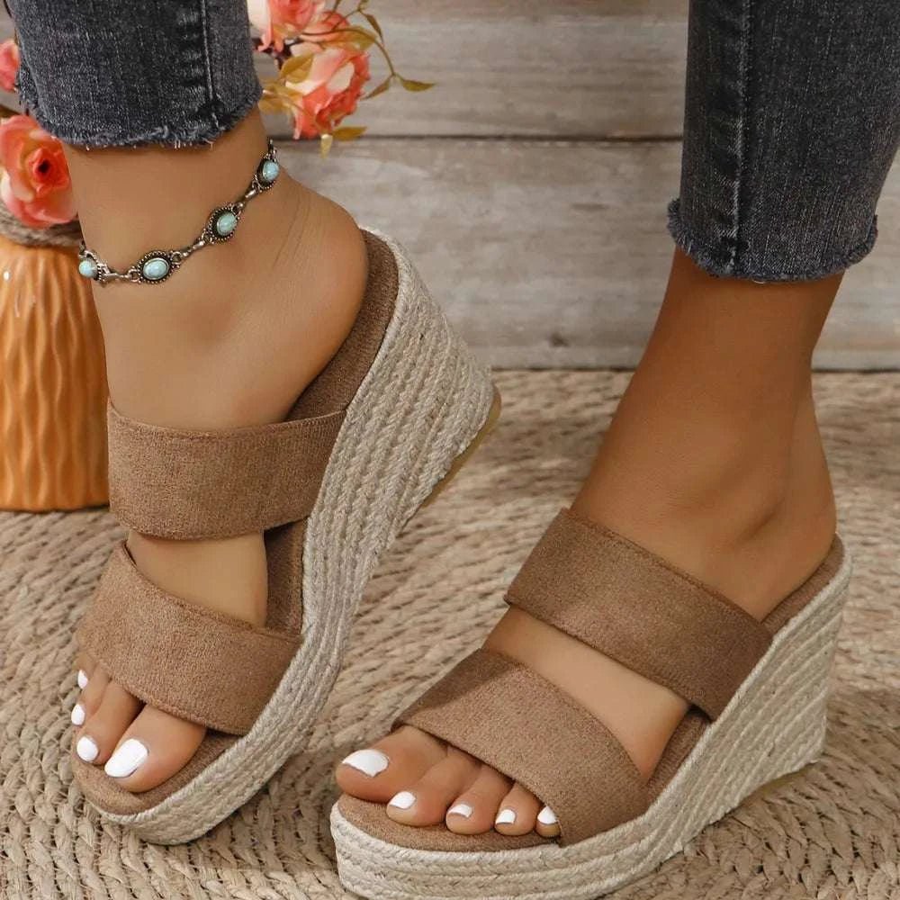 Open toe platform wedge sandals in brown suede with mid heels.