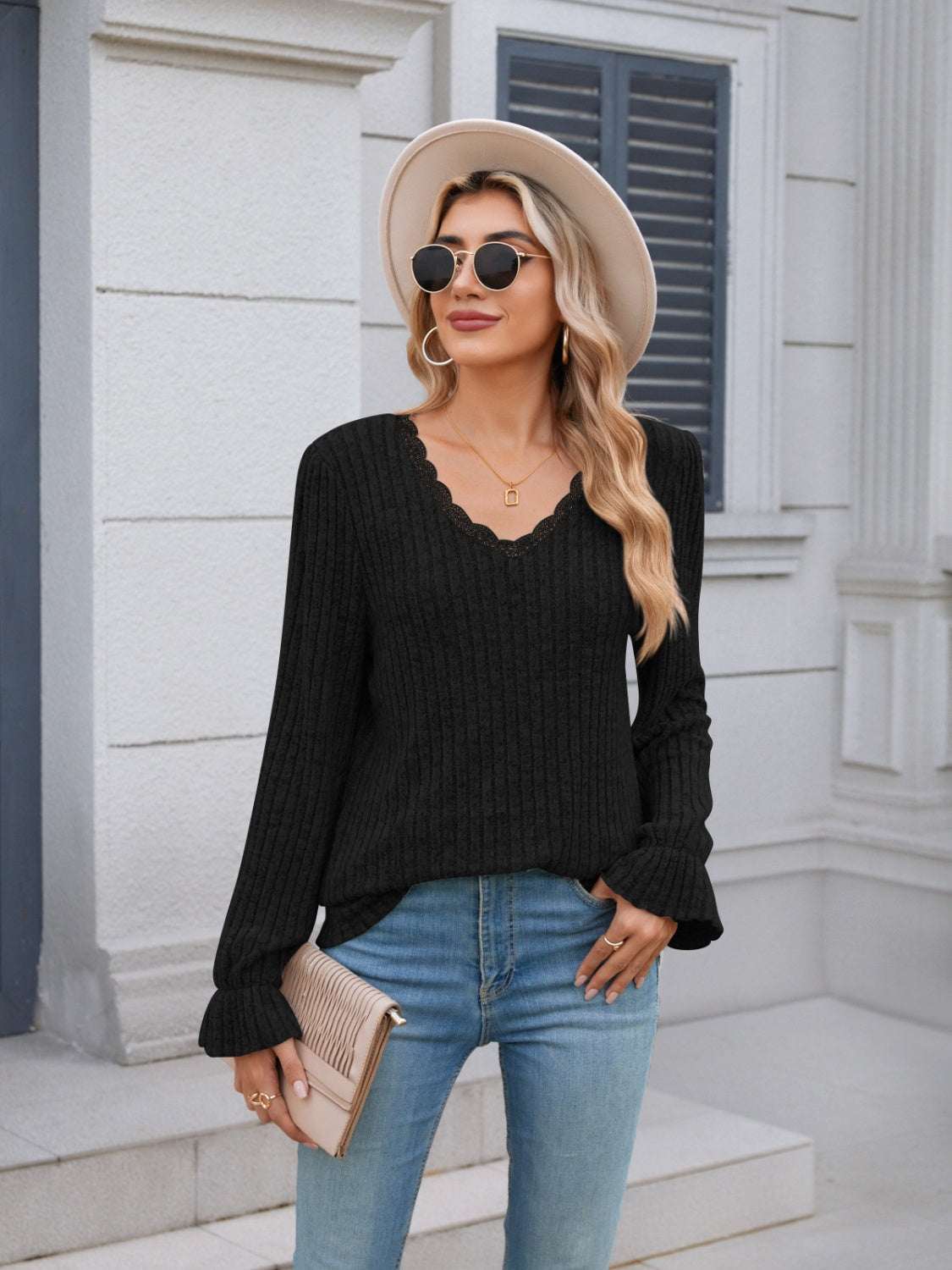 Lace detail V-neck long sleeve t-shirt with ruffled cuffs, black, model wearing hat and sunglasses.