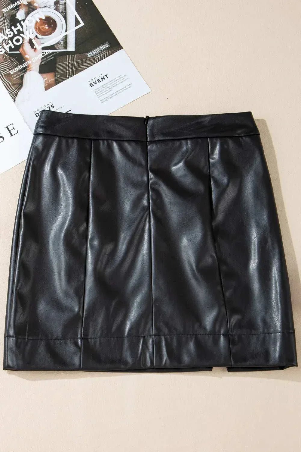 PU leather mini skirt in black with basic style and opaque finish.