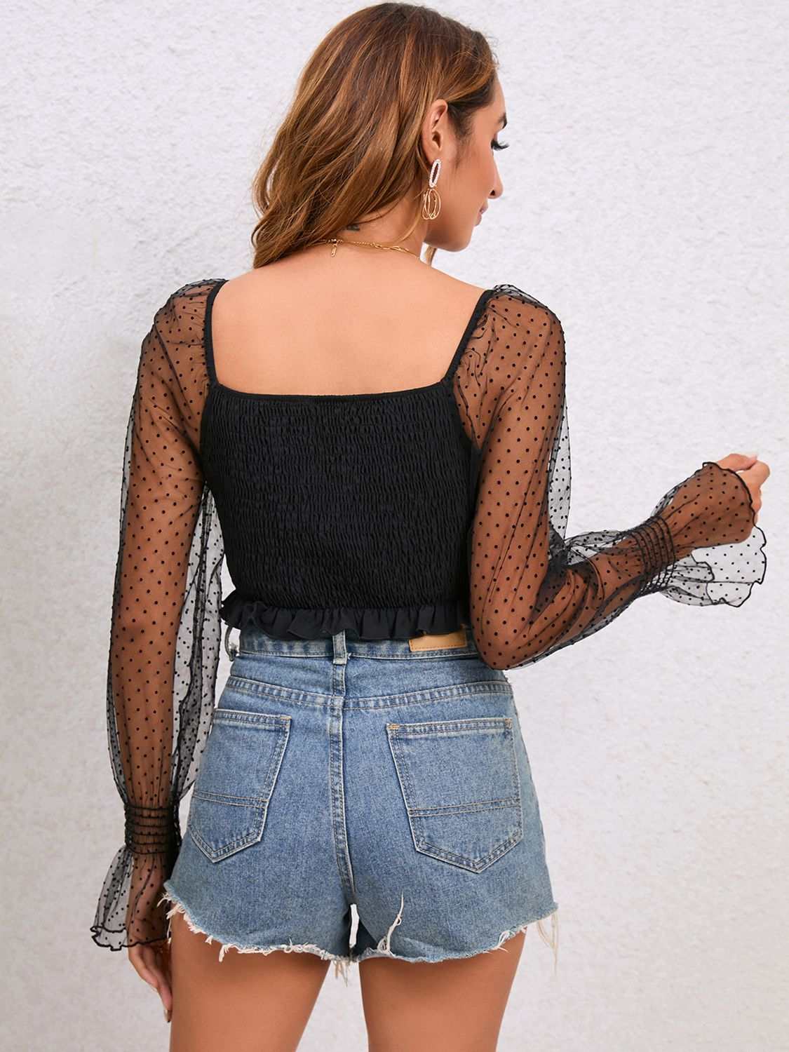 Chic solid cropped top with drawstring flounce sleeves and mesh detail.