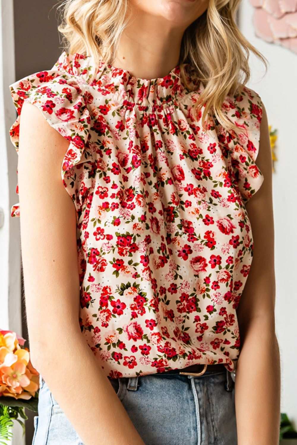 Ruffled floral round neck cap sleeve blouse in red and pink.