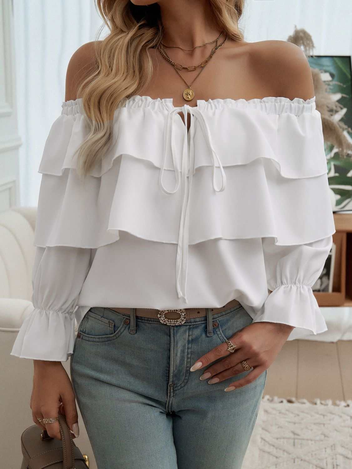 Off-shoulder flounce sleeve blouse with drawstring and ruffled details, opaque polyester fabric.