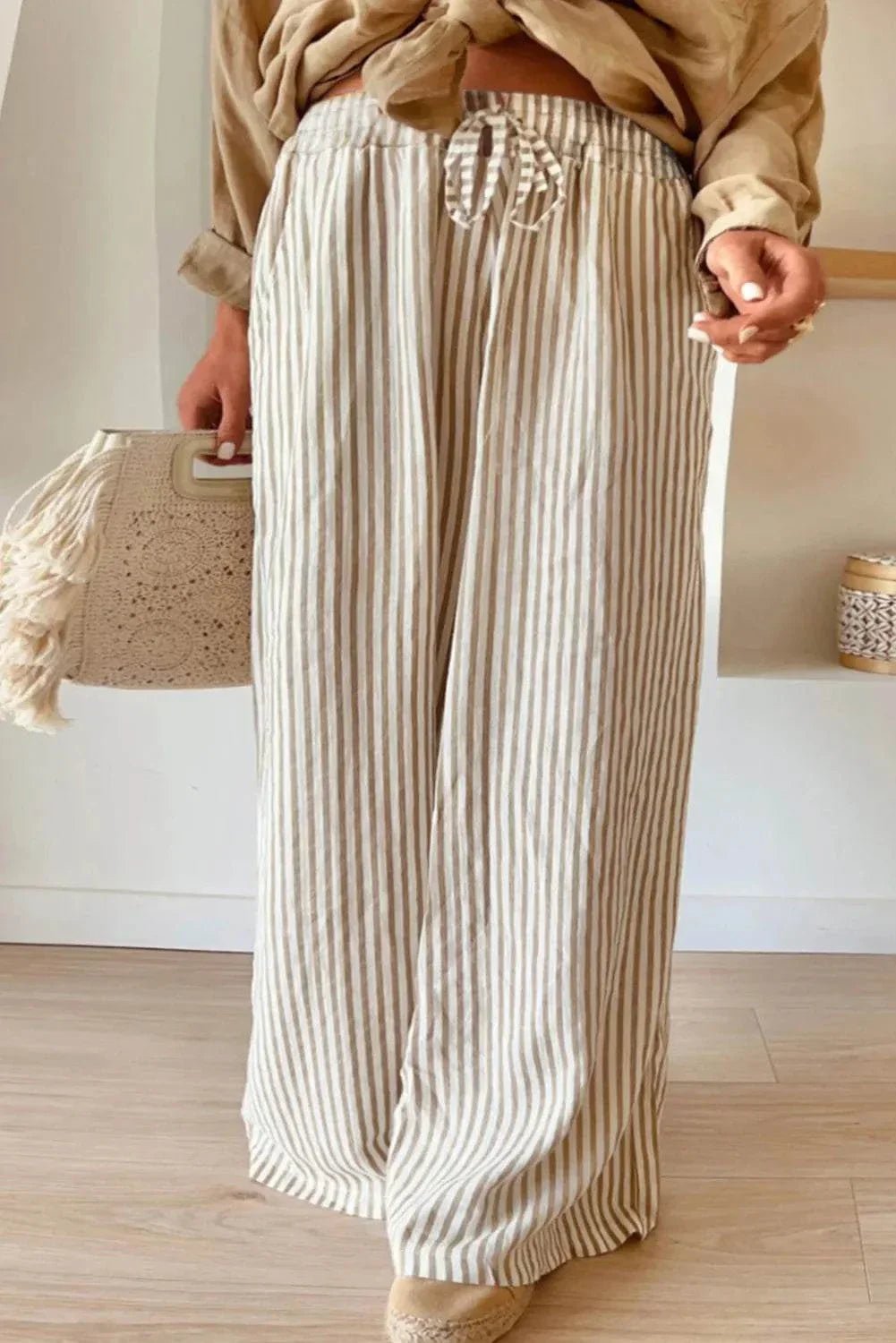 Plus size striped wide leg pants with drawstring in beige.