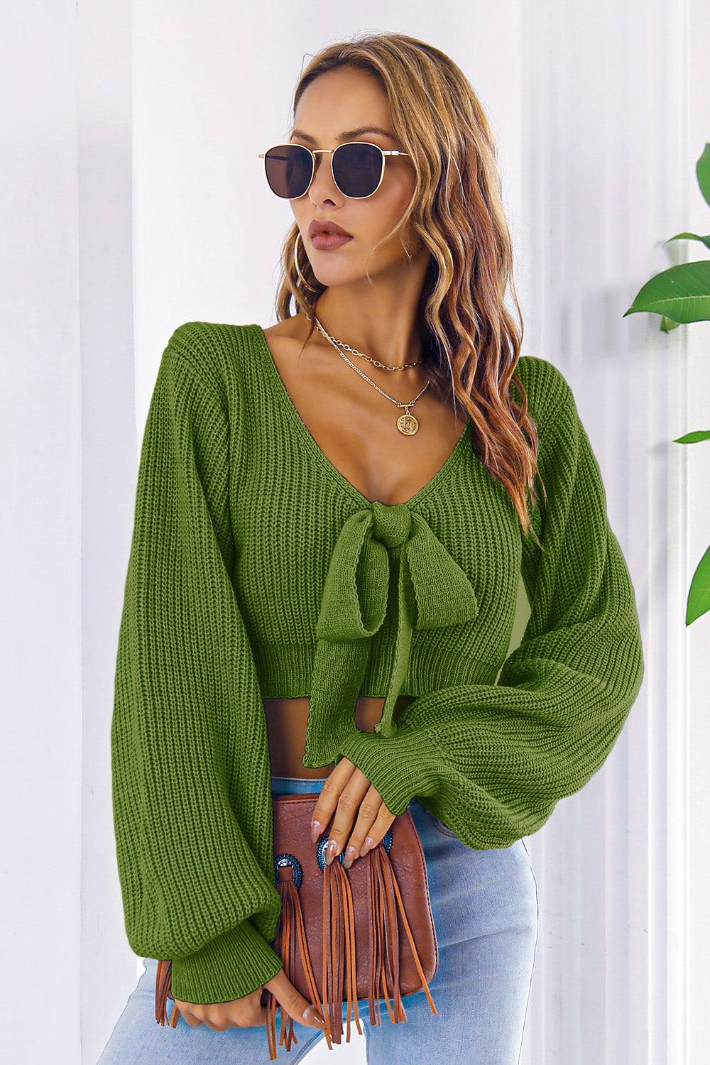 Bow V-Neck Long Sleeve Cropped Sweater in green, featuring a tie front and slight stretch, made of acrylic.