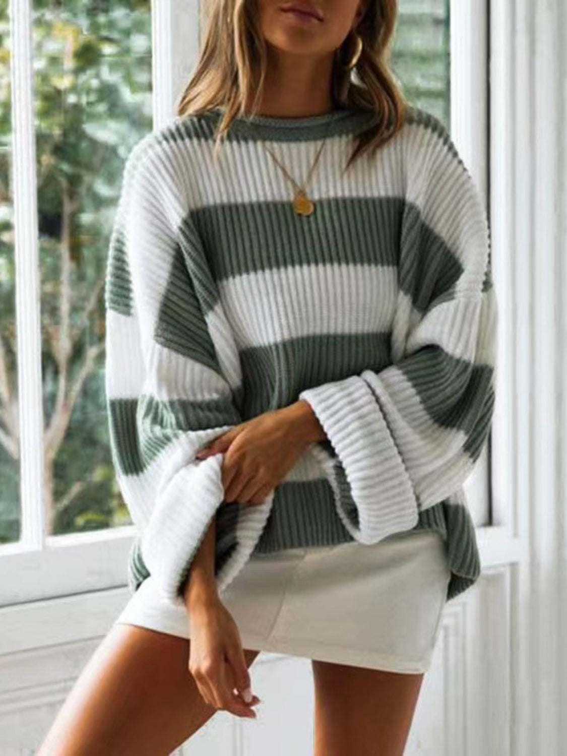 Round neck long sleeve sweater, slightly stretchy polyester, ribbed texture, white and green stripes.
