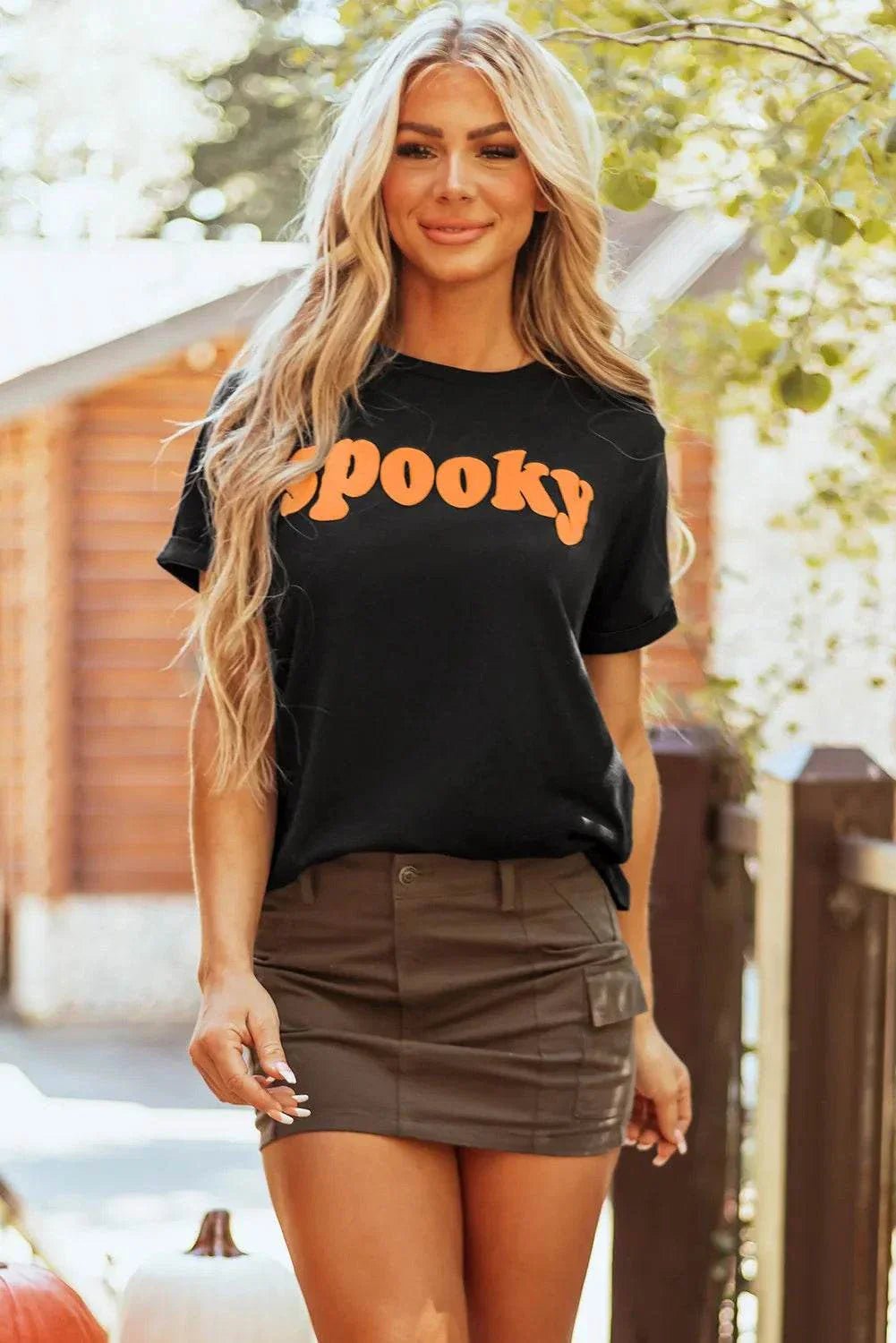 SPOOKY round neck short sleeve black t-shirt with orange text, basic style, slightly stretchy fabric.