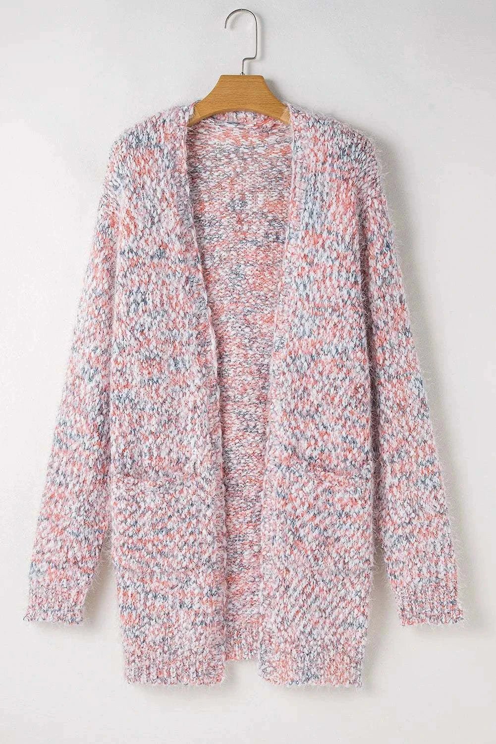 Pocketed open front long sleeve cardigan in multicolor knit pattern.