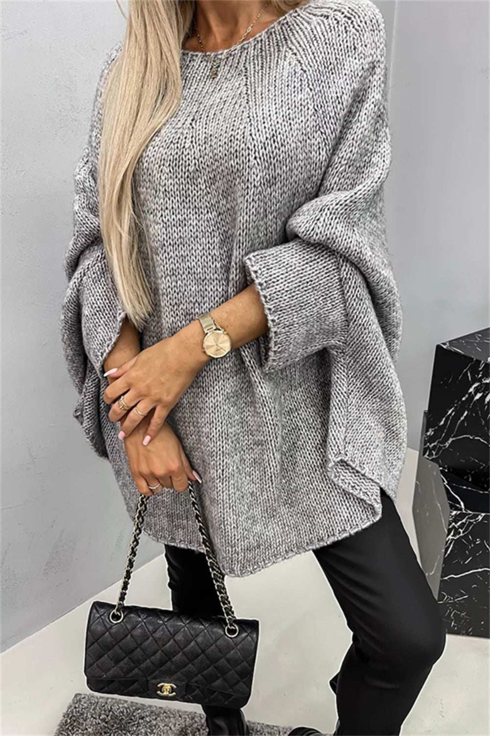 Round Neck Batwing Sleeve Sweater in gray with slightly stretchy polyester fabric.