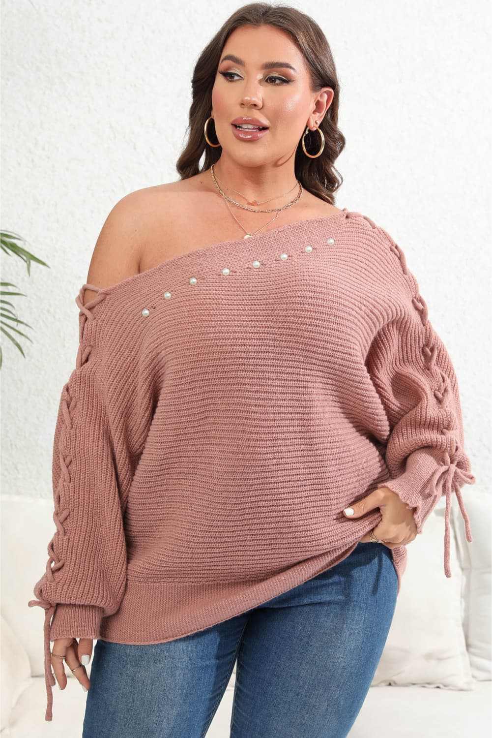 Plus size one shoulder beaded sweater in dusty rose with long sleeves and tied details