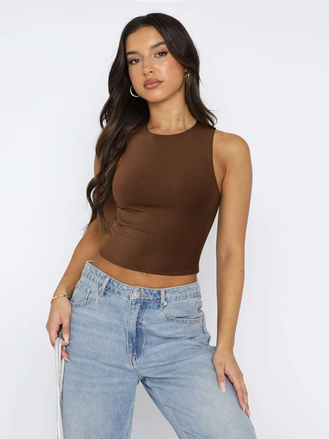 Brown round neck cropped tank top with basic style and slight stretch, made from 80% polyester and 20% elastane.