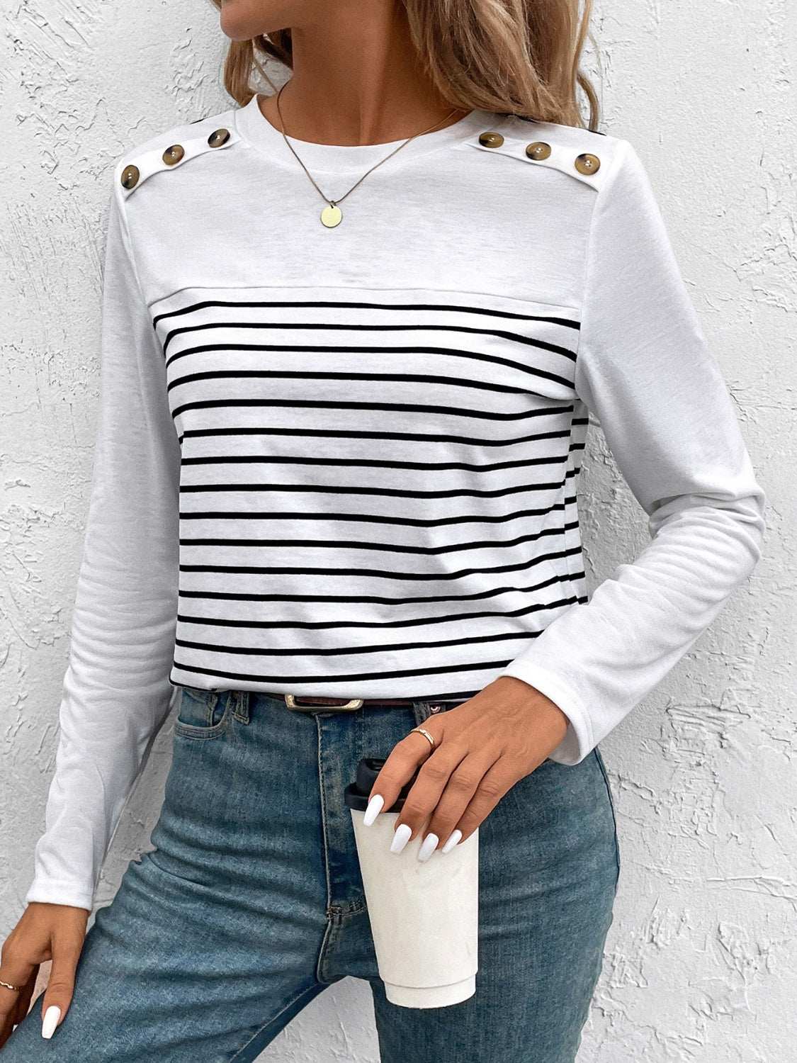 Decorative button striped round neck long sleeve t-shirt.