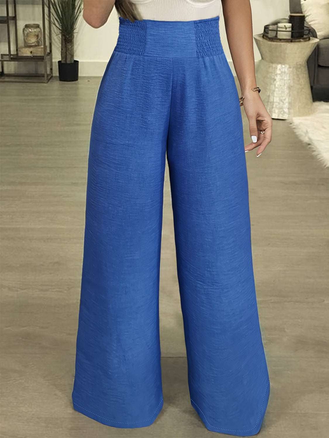 Plus size high waist wide leg pants in blue fabric.